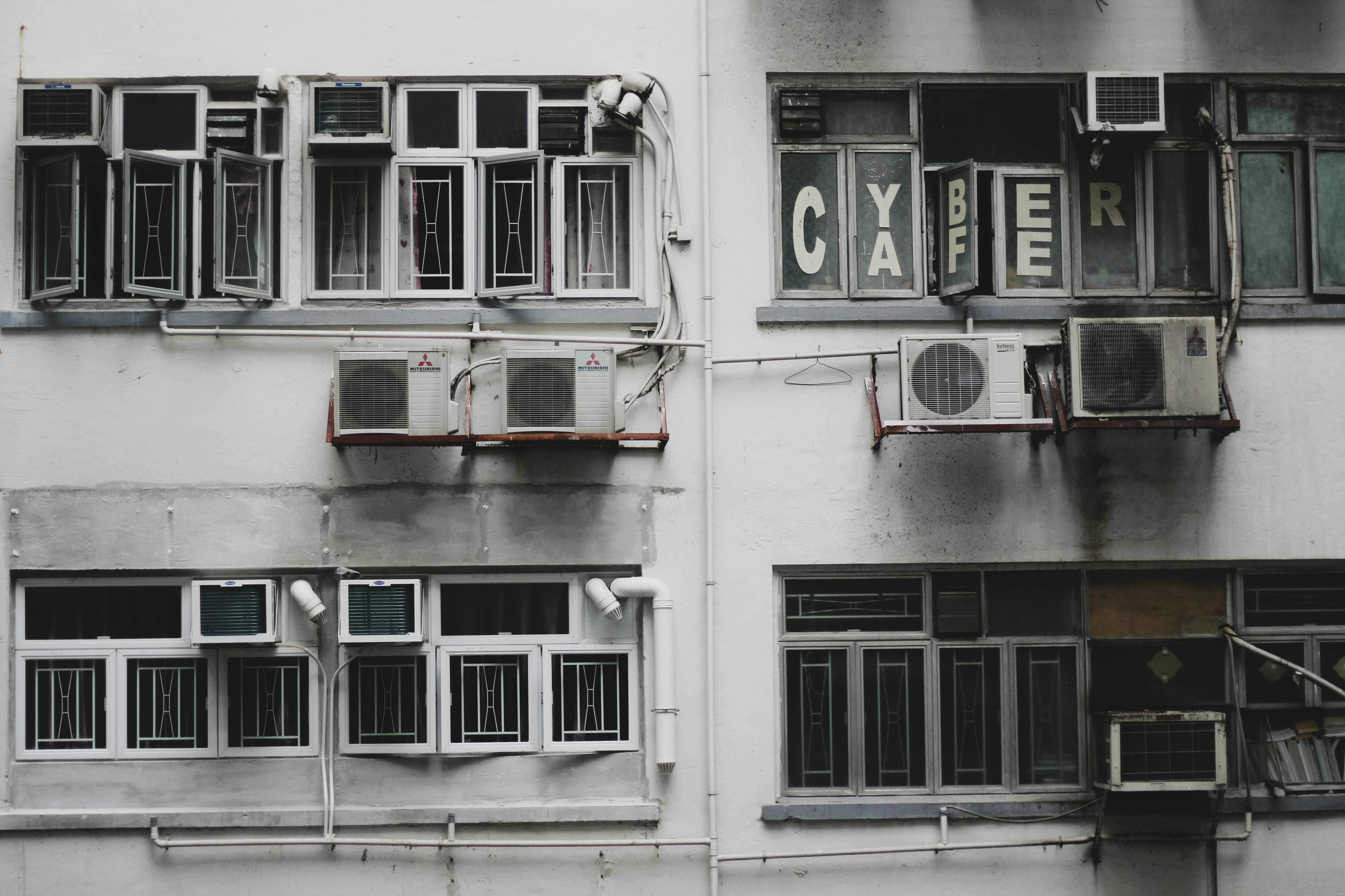 white window-type air conditioner on wall